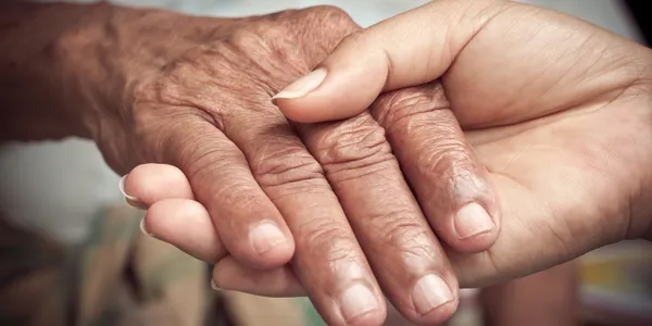 close up of people holding hands